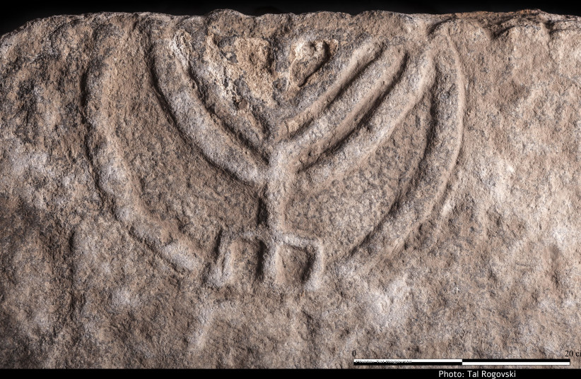The menorah-inscribed stone door discovered in Tiberias, December 2017 (photo credit: COURTESY OF TAL ROGOVSKY)