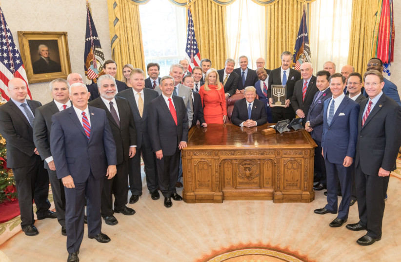 President Donald J. Trump receives the Friends of Zion Award with faith leaders in the Oval Office at the White House, Sunday, December 11, 2017, in Washington, D.C. (photo credit: OFFICIAL WHITE HOUSE PHOTO BY D. MYLES CULLEN)