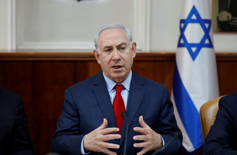 Israeli Prime Minister Benjamin Netanyahu attends the weekly cabinet meeting at the Prime Minister's office in Jerusalem. (photo credit: REUTERS)