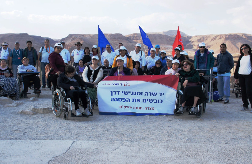 A group of wheelchair-bound Israelis visits Masada, December 2017 (photo credit: COURTESY YAD SARAH)