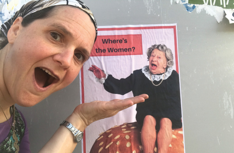 Kerry Bar-Cohn in front of a poster from her campaign to bring back posters featuring women to the streets of Ramat Beit Shemesh  (photo credit: KERRY BAR-COHN)