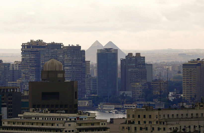 THE GIZA Pyramids are seen amid Cairo’s modern buildings (photo credit: AMR ABDALLAH DALSH / REUTERS)