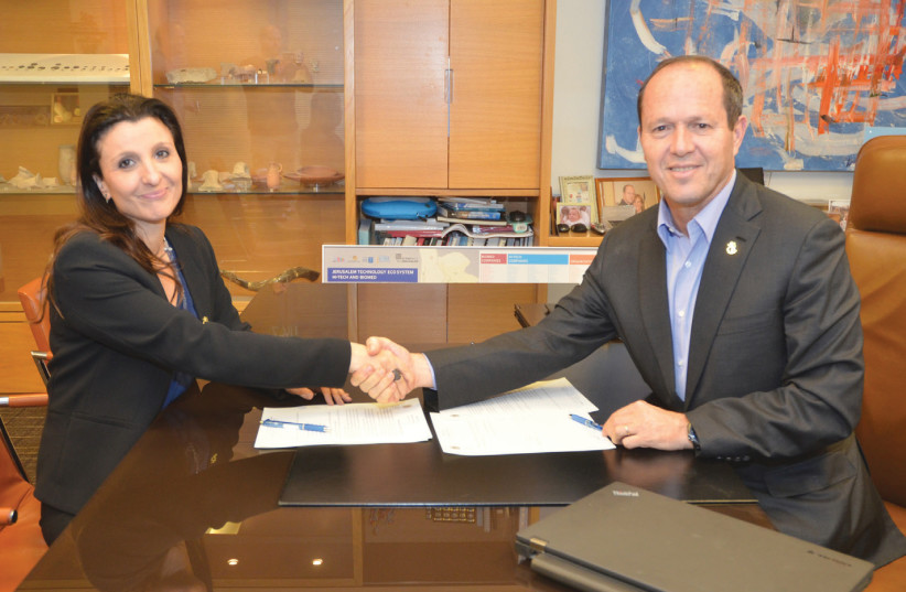 Beit Hansen exterior Jerusalem Mayor Nir Barkat and Fleur Hassan-Nahum, a Jerusalem city council member and new deputy mayor, conclude an agreement to expand the coalition to include the Yerushalmim Party (photo credit: JACKIE LEVY/JERUSALEM MUNICIPALITY)