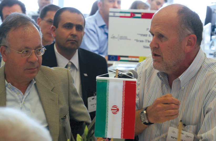 FORMER IDF intelligence chief Aharon Zeevi Farkash (right), playing Iran, sits with experts during an Iran wargame in Herzliya in 2010 (photo credit: REUTERS/NIR ELIAS)