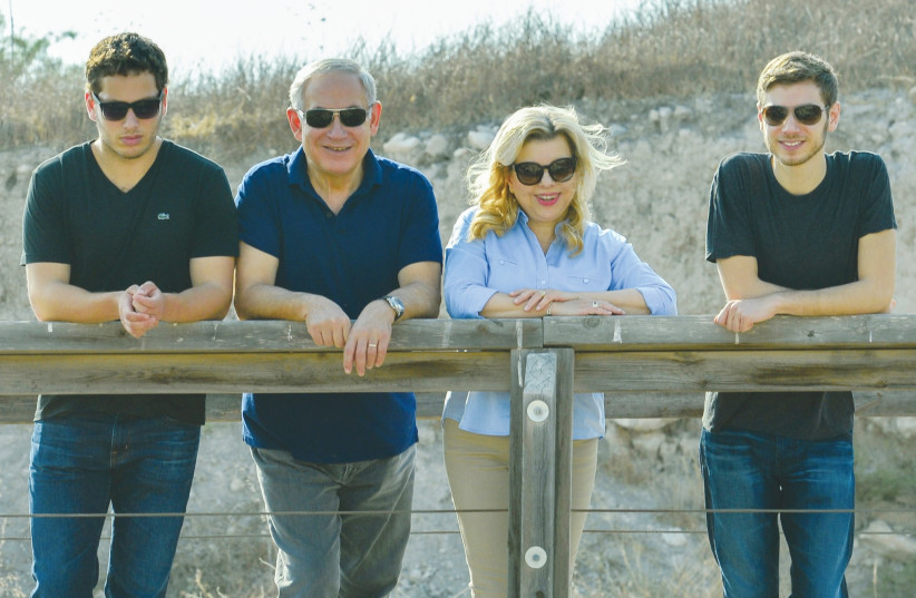 PRIME MINISTER Benjamin Netanyahu and his wife, Sara, tour the Magshimim Forest together with their sons Yair (right) and Avner in 2016. (GPO) (photo credit: GPO)