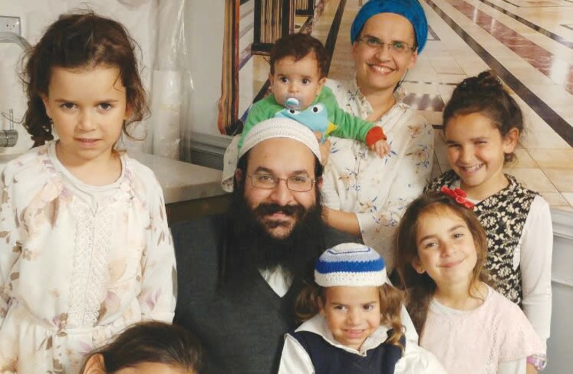 RAZIEL SHEVACH, whom a terrorist murdered on January 9th, 2018, is surrounded by his wife and six children in this recent photograph. (photo credit: Courtesy)