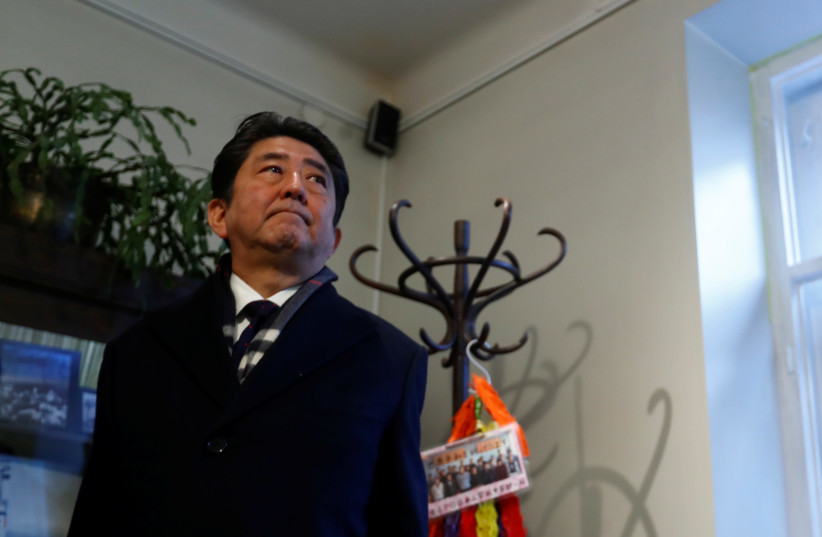 Japan's Prime Minister Shinzo Abe visits a former home of Chiune Sugihara, a Jew-saving Japanese diplomat in Kaunas, Lithuania. (photo credit: REUTERS)