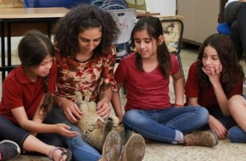 Arab-Israeli pupils participate in Hakol Chai's animal compassion program. (photo credit: COURTESY HAKOL CHAI)