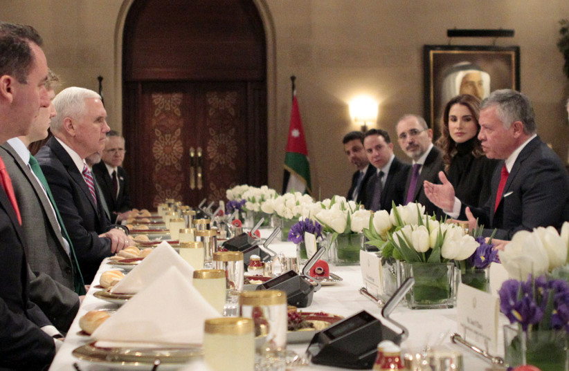 Jordanian King Abdullah II eats lunch with US Vice President Mike Pence in the capital Amman (photo credit: YOUSEF ALLAN / JORDANIAN ROYAL PALACE / AFP)