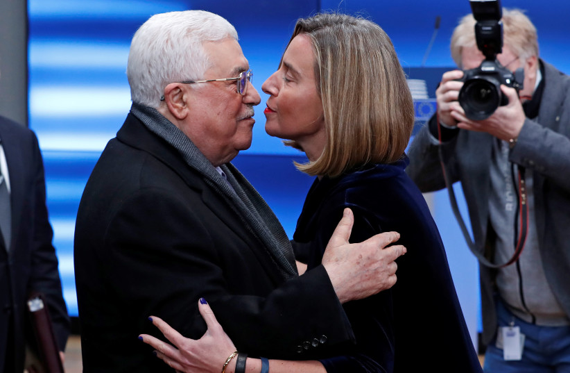 European High Representative for Foreign Affairs Federica Mogherini welcomes Palestinian President Mahmoud Abbas in Brussels, Belgium (photo credit: YVES HERMAN / REUTERS)