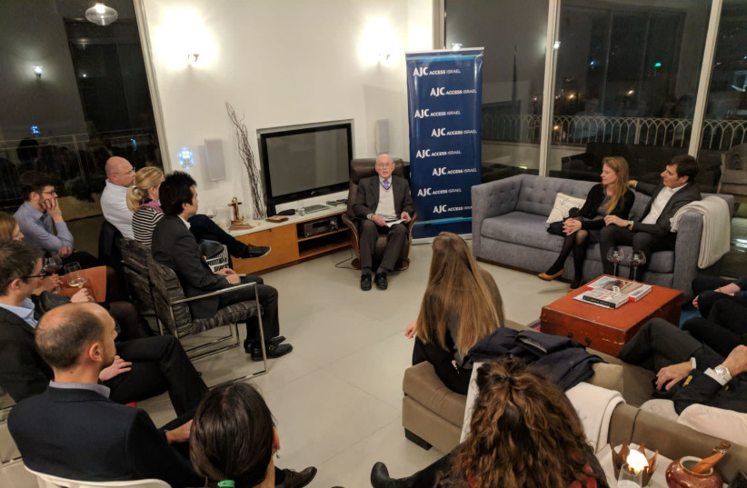 AJC ACCESS members and diplomats listen to Holocaust survivor Sylvian Brachfeld tell his story (photo credit: Courtesy)