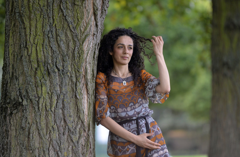 Masih Alinejad, a Britain-based Iranian journalist, poses for a portrait in London October 8, 2013. (credit: REUTERS/TOBY MELVILLE)