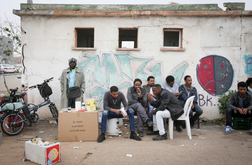 African asylum seekers wait to apply for a visa in Bnei Brak, Israel (credit: MARC ISRAEL SELLEM/THE JERUSALEM POST)
