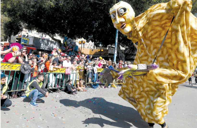 A PURIM street carnival in Holon in 2015 (photo credit: MARC ISRAEL SELLEM/THE JERUSALEM POST)
