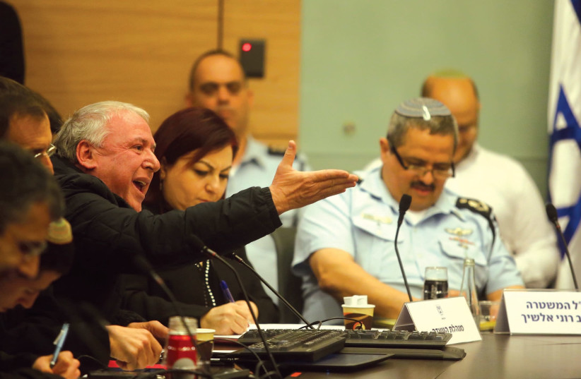 COALITION CHAIRMAN David Amsalem shouts during a stormy session of the Knesset Interior Committee on Tuesday about law enforcement investigations into corruption cases, with Police Insp.-Gen. Roni Alsheich (right). (Marc Israel Sellem/The Jerusalem Post) (photo credit: MARC ISRAEL SELLEM/THE JERUSALEM POST)