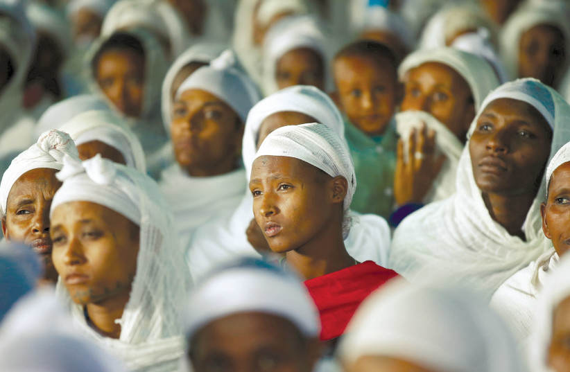 Members of the Falash Mura community attend a prayer service at the Hatikva Synagogue in Gondar, northern Ethiopia, in 2016 (photo credit: TIKSA NEGERI / REUTERS)