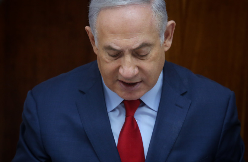 Prime Minister Benjamin Netanyahu at a weekly cabinet meeting on March 11, 2018 (photo credit: MARC ISRAEL SELLEM/THE JERUSALEM POST)