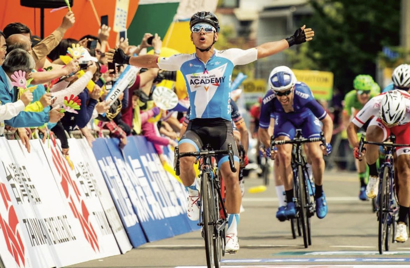 Israel Cycling Academy's Colombian sprinter Edwin Avila raises his hands in triumph after winning Stage 3 of the Tour de Taiwan yesterday, the team’s first win of the 2018 season. Another part of the team’s squad completed its participation yesterday in the snowy Tirreno Adriatico (inset), an elite  (photo credit: NOA ARNON)