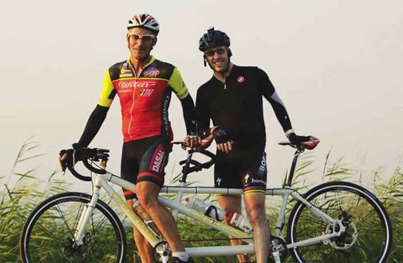 Oren Blitzblau (right), who was blinded during his IDF service, and Yossi Pocker (left) will ride a tandem bike together at the Israeli Gran Fondo, a cycling event that will take place in the Dead Sea and the city of Arad over March 23-24 (photo credit: YARON PEREL)