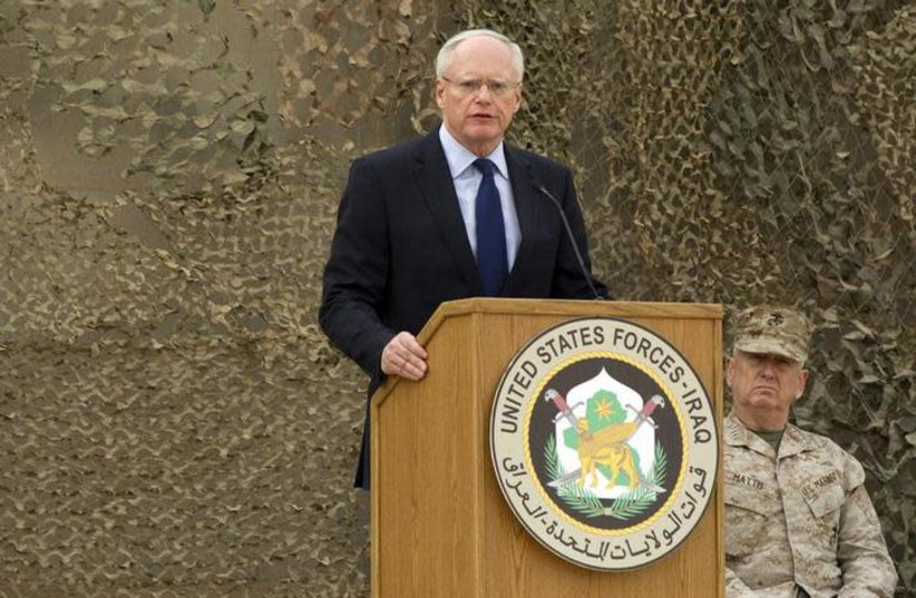  James Jeffrey (L) speaks during a ceremony for the US military to retire its ceremonial flags, signifying the end of military presence in Iraq, at the Baghdad Diplomatic Support Center in Baghdad December 15, 2011 (photo credit: LUCAS JACKSON/REUTERS)