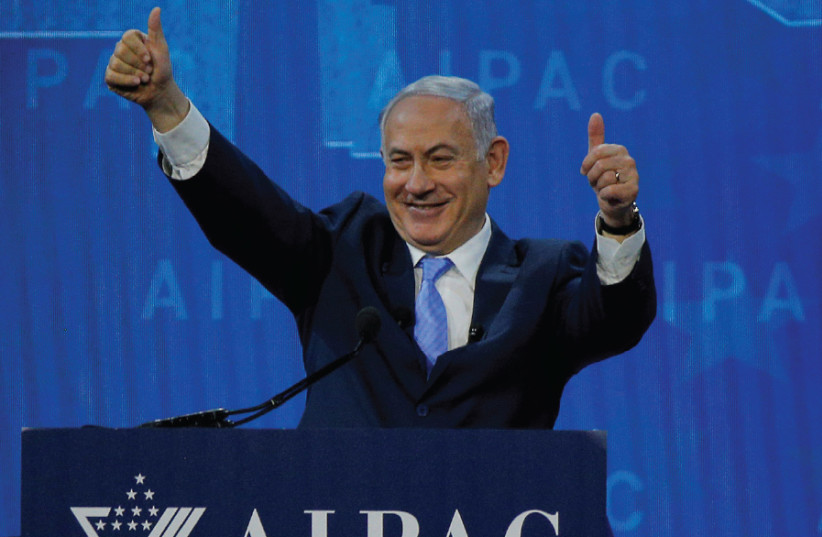 PRIME MINISTER Benjamin Netanyahu received a warm welcome during AIPAC’s policy conference in Washington, March 2018 (photo credit: BRIAN SNYDER/REUTERS)