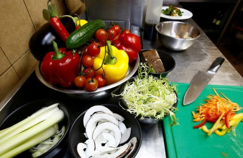 Vegetables are seen in vegetarian restaurant "Green Cuisine" in Minsk, Belarus February 1, 2018 (photo credit: VASILY FEDOSENKO / REUTERS)