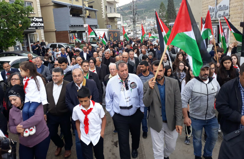 Hundreds of Arab-Israelis march under Palestinian flags in Ara'be   (photo credit: YAHIA AMAL JABARIN/ TPS)