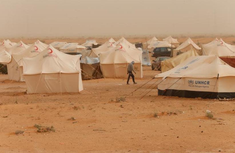 Tawergha displaced people are seen at a camp in the Garart al-Gatef, Libya March 25, 2018. Picture taken March 25, 2018. (photo credit: REUTERS/ISMAIL ZITOUNY)