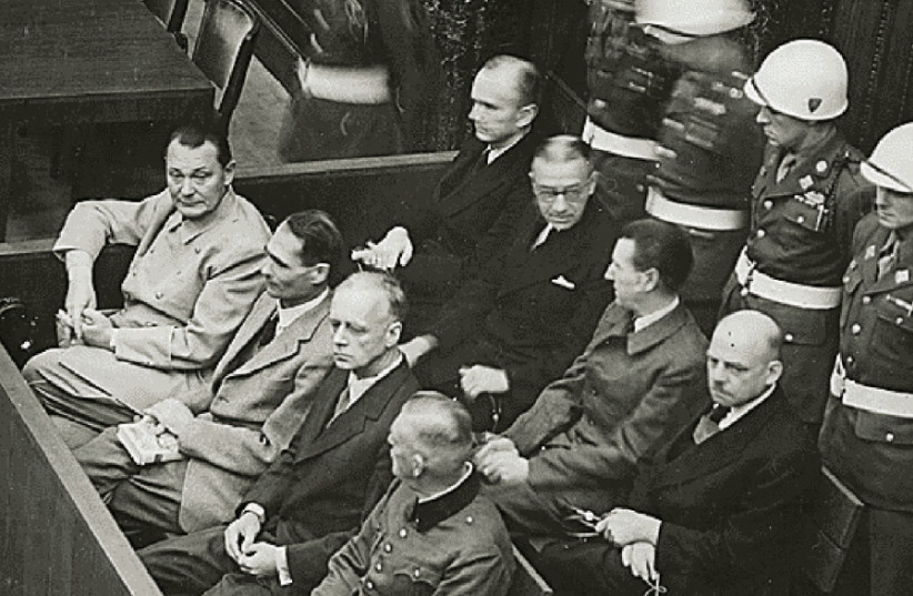 Nazi defendants (left to right, front row) Hermann Goring, Rudolf Hess, Joachim von Ribbentrop and Wilhelm Keitel sit in the dock of their war crimes trial at Nuremberg (photo credit: REUTERS)