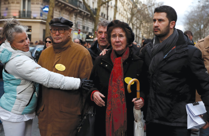 BEATE AND SERGE Klarsfeld attend a gathering in March 2018 in Paris in memory of Mireille Knoll, a Holocaust survivor who was stabbed to death in her apartment a week earlier (photo credit: REUTERS/GONZALO FUENTES)