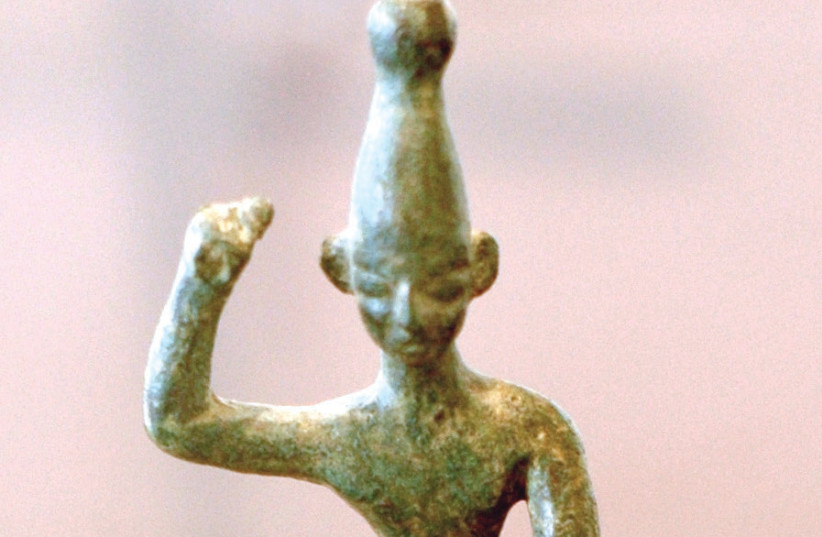 AN ANCIENT Canaanite idol of Baal with raised arm from the 14th–12th centuries BCE, found at Ras Shamra (ancient Ugarit in modern-day Syria) (photo credit: Wikimedia Commons)