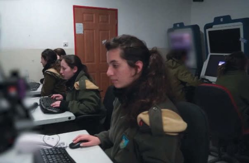 Members of the IDF’s field intelligence corps from the observation unit of ‘Eagle’ Battalion 595, work a command center not far from the border with Syria (photo credit: IDF SPOKESPERSON'S UNIT)