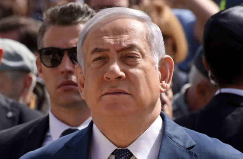 PRIME MINISTER Benjamin Netanyahu attends a ceremony marking Holocaust Remembrance Day at the Yad Vashem Holocaust Remembrance Center in Jerusalem, April 2018 (photo credit: DEBBIE HILL/REUTERS)