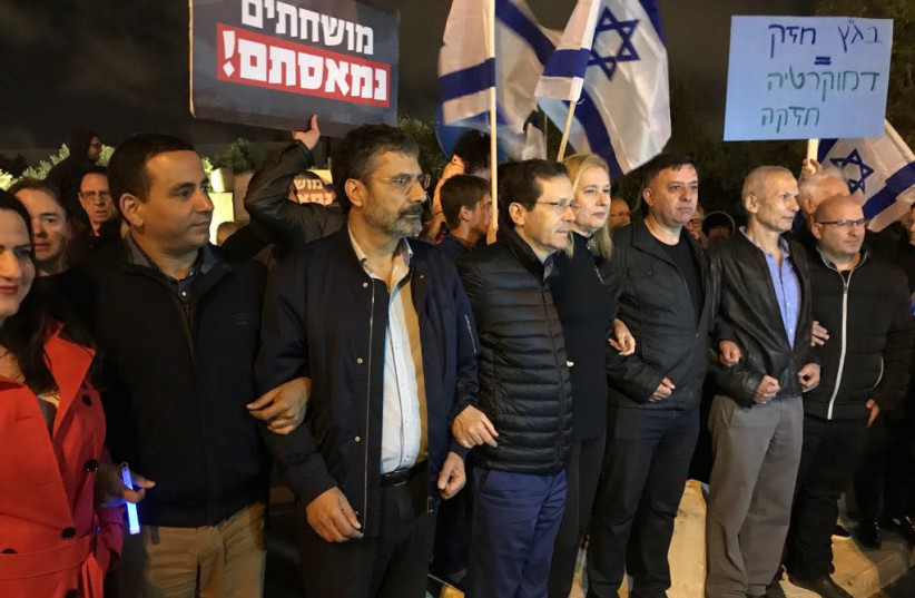 Zionist Union MKs Michal Biran, Yoel Hasson, Yosi Yona, Isaac Herzog, Zipi Livni, Avi Gabbay, Omer Bar-Lev and Eran Hermoni at Supreme Court protest in Jerusalem, April 21, 2018. (photo credit: UDI SHAHAM)