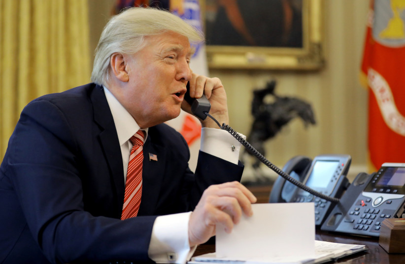 US President Donald Trump congratulates Prime Minister Leo Varadkar of Ireland, during a phone call at the Oval Office, June 27, 2017 (photo credit: CARLOS BARRIA / REUTERS)