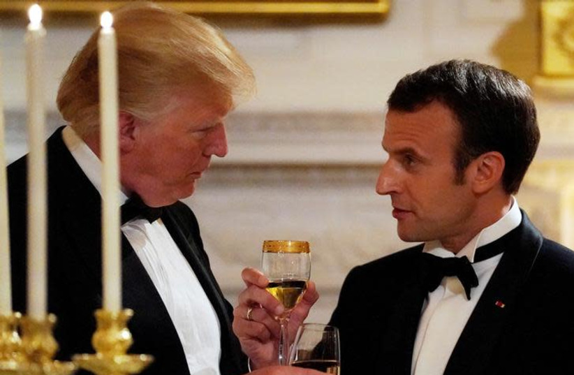 French President Emmanuel Macron toasts US President Donald Trump during a State Dinner at the White House in Washington, US April 24, 2018.  (photo credit: REUTERS/CARLOS BARRIA)