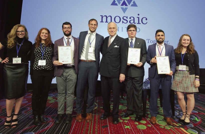 Benjamin Levy, Mosaic United CEO (center left), and WJC president Ron Lauder (center right) pose with Mosaic students (photo credit: MARC ISRAEL SELLEM/THE JERUSALEM POST)