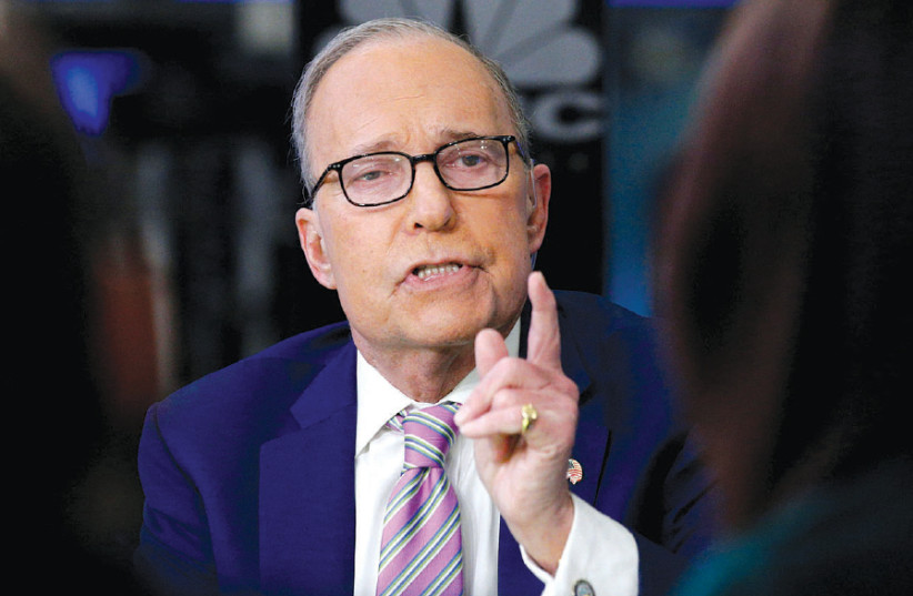 Economic analyst Larry Kudlow appears on CNBC at the New York Stock Exchange on March 7, 2018 (photo credit: BRENDAN MCDERMID/REUTERS)