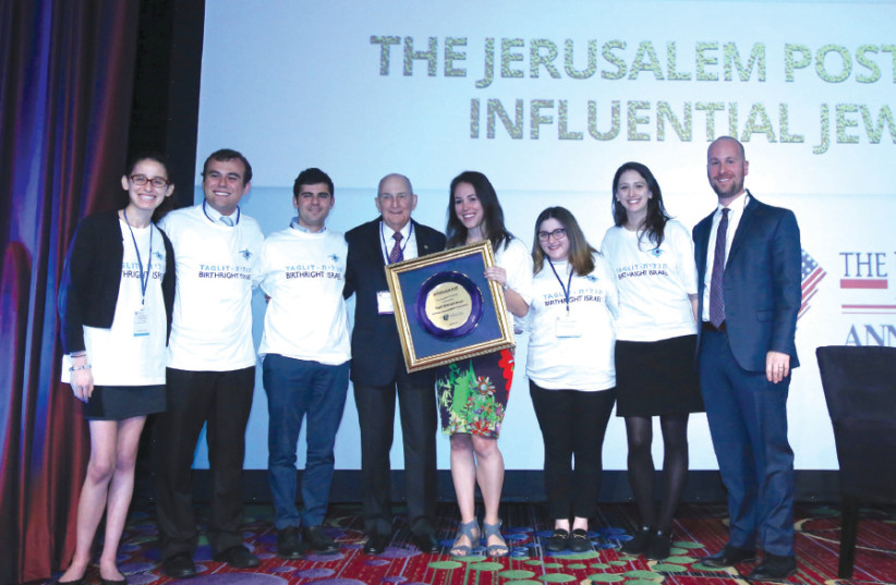 CHARLES BRONFMAN appears on stage with ‘Jerusalem Post’ Editor-in-Chief Yaakov Katz (far right) and Birthright Israel alumni at the paper’s conference in New York on April 29, 2018. The organization was honored for its work in strengthening relations between Diaspora Jewry and Israel (photo credit: MARC ISRAEL SELLEM)