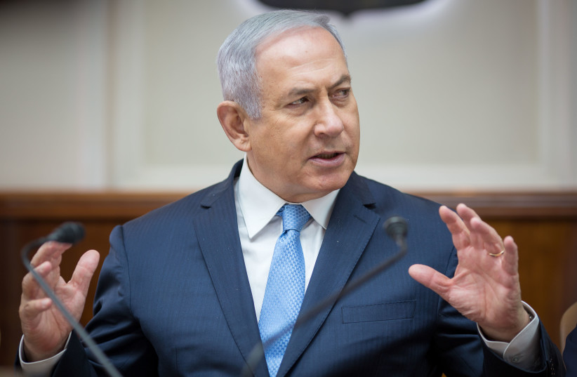Prime Minister Benjamin Netanyahu at a weekly cabinet meeting, May 6th, 2018. (photo credit: EMIL SALMAN/POOL)