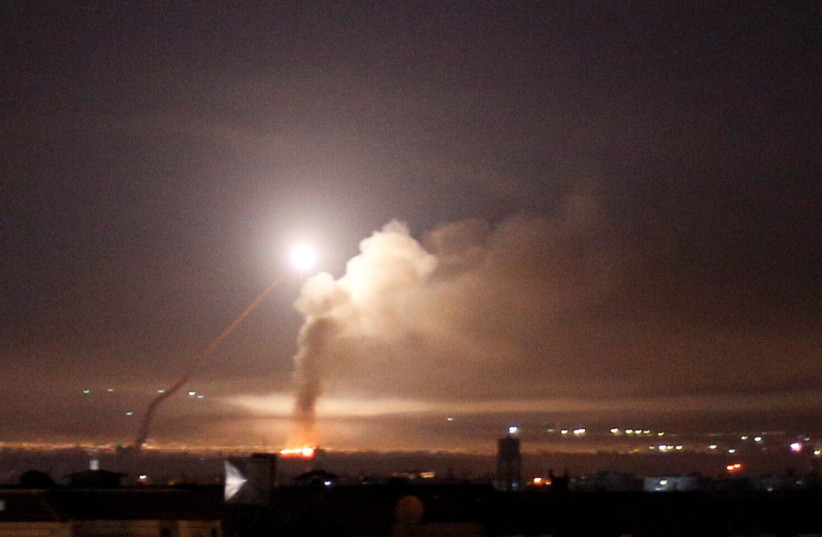 Missile fire is seen from Damascus, Syria May 10, 2018 (photo credit: OMAR SANADIKI/REUTERS)