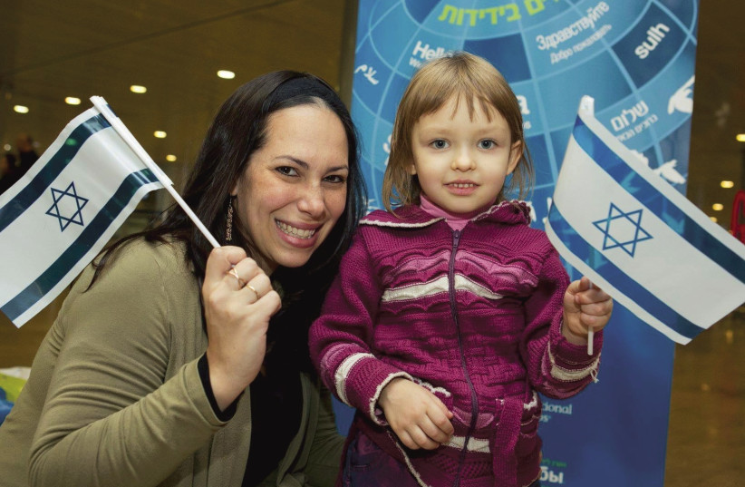 YAEL ECKSTEIN seen at Ben Gurion airport greeting a young olah. (photo credit: Courtesy)