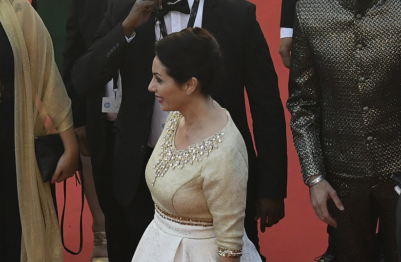Israeli Culture Minister Miri Regev wearing a dress featuring the old city of Jerusalem at the Cannes Film Festival, May 17, 2017 (photo credit: ANTONIN THUILLIER / AFP)