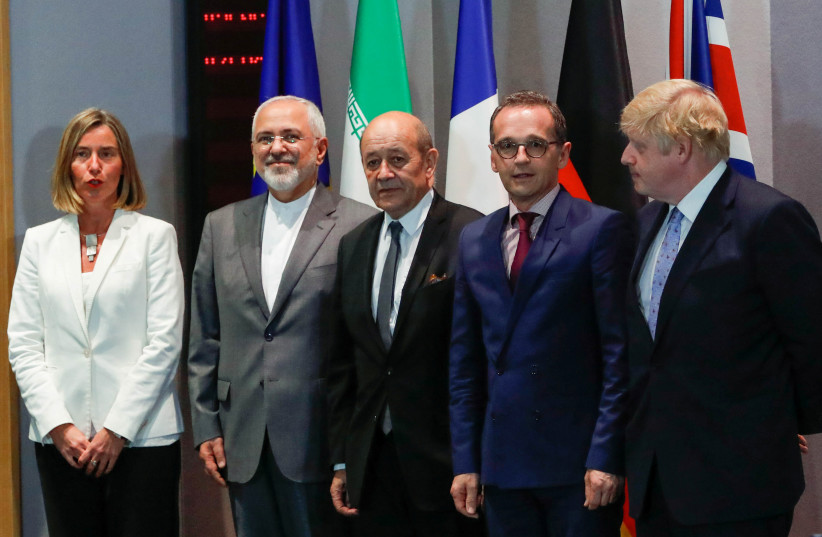 Britain's Foreign Secretary Boris Johnson, German Foreign Minister Heiko Maas, French Foreign Minister Jean-Yves Le Drian and EU High Representative for Foreign Affairs Federica Mogherini take part in meeting with Iran's Foreign Minister Mohammad Javad Zarif in Brussels, Belgium, May 15, 2018. (photo credit: REUTERS/YVES HERMAN)