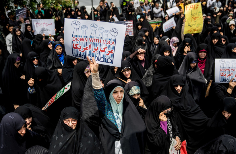 Iranian women gather during a protest against U.S. President Donald Trump's decision to walk out of a 2015 nuclear deal, in Tehran, Iran, May 11, 2018 (photo credit: REUTERS/TASNIM NEWS AGENCY)