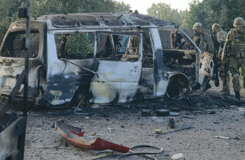 A VAN destroyed during fighting in eastern Ukraine’s Donbas conflict which is now in its fourth year. (photo credit: REUTERS)