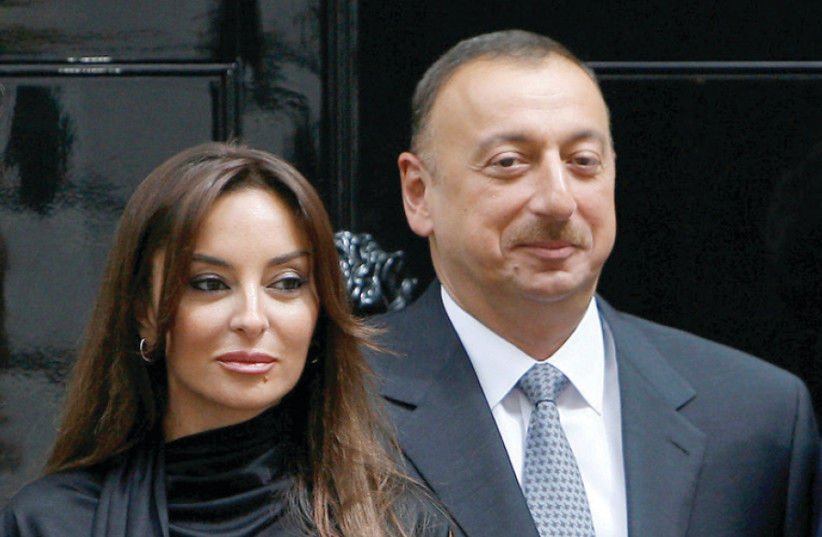 Azerbaijan’s President Ilham Aliyev and his wife Mehriban (photo credit: LUKE MACGREGOR / REUTERS)