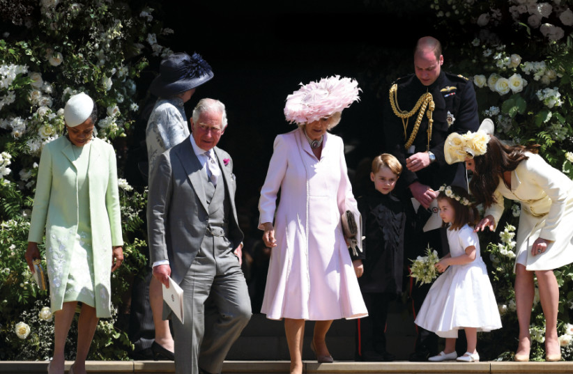 From left : Meghan’s mother Doria Ragland, Britain’s Prince Charles, Camilla, the Duchess of Cornwall, Prince George, Prince William, Duke of Cambridge, Catherine, Duchess of Cambridge and Princess Charlotte (2nd from right) leave St. George’s Chapel after the royal wedding ceremony of Prince Harry, (photo credit: NEIL HALL / POOL VIA REUTERS)
