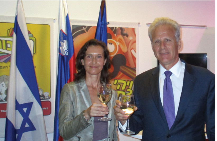 SLOVENIAN AMBASSADOR Barbara Susnik and Deputy Minister for Public Diplomacy Michael Oren share a toast on Slovenia’s National Day (photo credit: Courtesy)