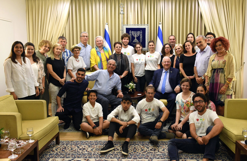 President of Israel Reuven Rivlin meets with head of Jordan River Village and children who live there.  (photo credit: HAIM ZACH/GPO)